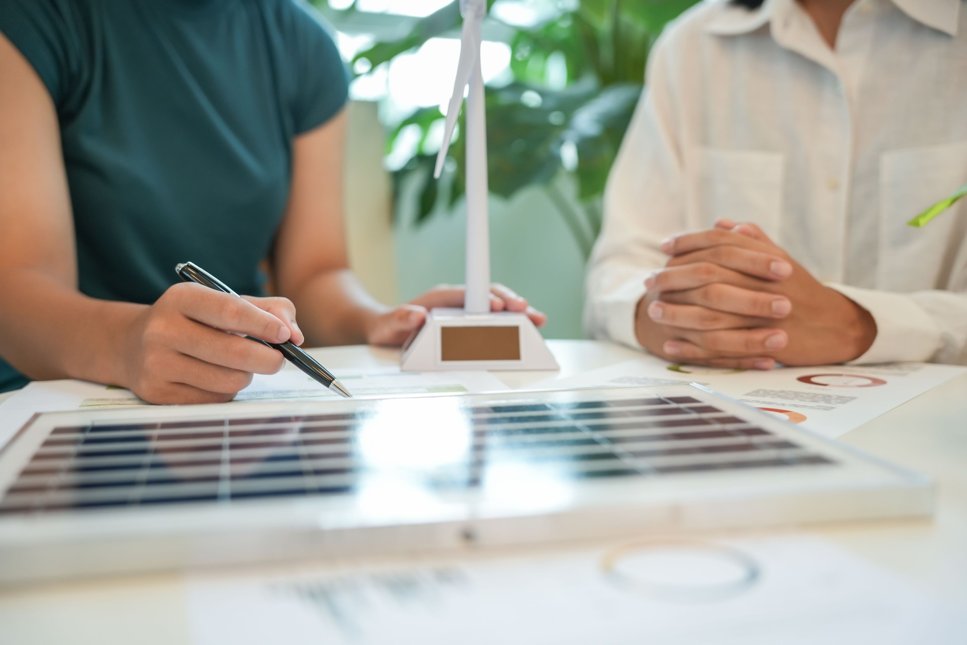 Solar panels green energy Business people working in green eco friendly office business meetingÂ creative ideas for business eco friendly professional teaching corporate people sustainable electricity